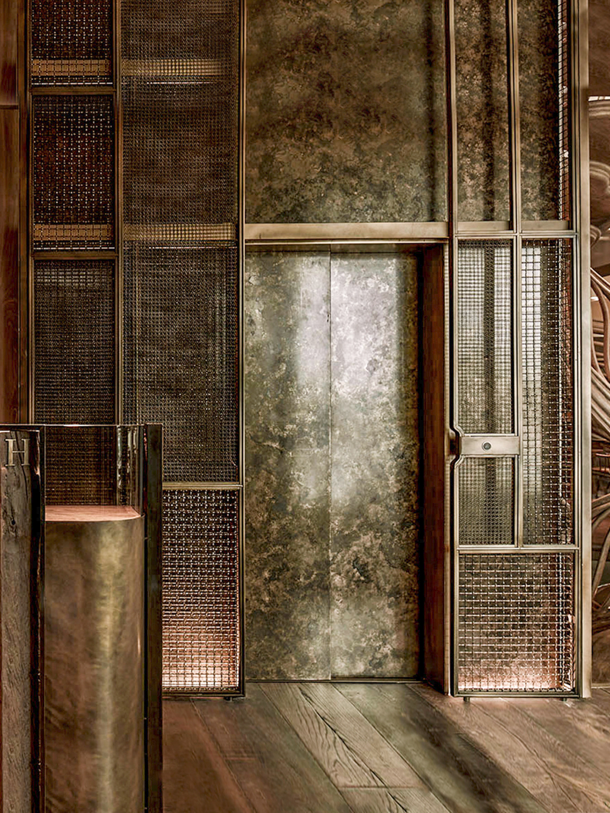 Hide Restaurant, 85 Piccadilly, London. - Exterior cladding panels to lift shaft in AmronRigid Woven Architectural mesh M22-28 and I-188 in Antique Bronze.