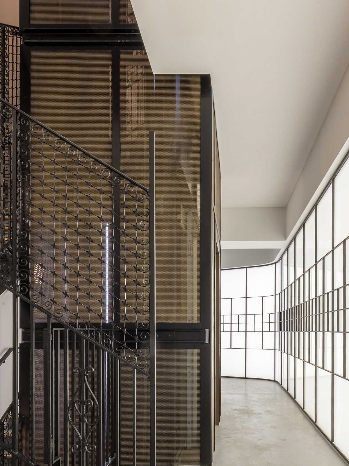 Minerva House, 26 Hatton Garden, Holborn, London. - Showing lift shaft clad in Amron Architectural Mesh LPZ-71 in Antique Brass