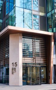 Canopy in Chocolate PVD stainless steel V-Grooved and folded to appear as solid bronze. Fabricated and installed by John Desmond Ltd. - Office building, 15 Fetter Lane, EC4A, London. - Architects: McBains Cooper - Client: British Steel Pension Fund Trustees Ltd - Fit-out: Nucom Interiors