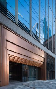 Stepped door entry at the Shanghai Bund Financial Centre in PVD coloured stainless steel, Rose Gold Vibration. - Architects: Foster & Partners; Heatherwick Studio - PVD coloured stainless steel:: Double Stone Steel in partnership with John Desmond Ltd.