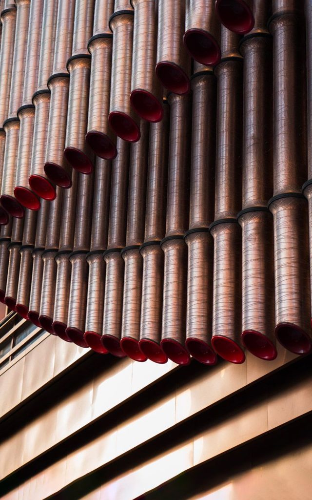 A close-up view of the façade of the Shanghai Bund Arts and Cultural Centre made from PVD stainless steel in Rose Gold Vibration. - Architects: Foster & Partners; Heatherwick Studio - PVD: Double Stone Steel in partnership with John Desmond Ltd.