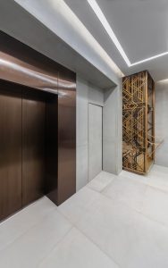 Elevator door skins, overhead and side panels in PVD coloured stainless steel Chocolate Vibration. - Axtell House, 23-24 Warwick St, Soho, London W1B 5NQ - Renovated office building - Architects: Darling Associates - Client: E&A Property Investment Company - PVD coloured stainless steel: John Desmond Ltd