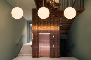 The Gaslight Building, 29 – 35 Rathbone Street, London. - Developer I.S.A Holdings - Interior architecture and design: bureau de change design office - Architects: dMFK Architects - Laser-cut PVD coloured stainless steel in custom Bronze Hairline for stairs, lift core and architectural detailing by Double Stone Steel in partnership with John Desmond Ltd. - Photography by Gilbert McCarragher