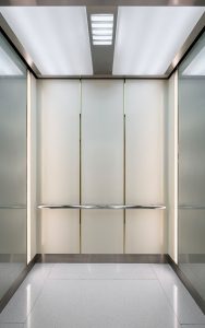 PVD coloured stainless steel in Nickel Hairline and Chrome Vibration for elevator cab interior with Brass Mirror detailing and Chocolate Vibration frieze and kickplate. - Krungsri Ploenchit Tower, Thailand. - Elevator: A global elevator brand - Architecture and design: Palmer & Turner, Hong Kong - PVD coloured stainless steel by Double Stone Steel in partnership with John Desmond Ltd.