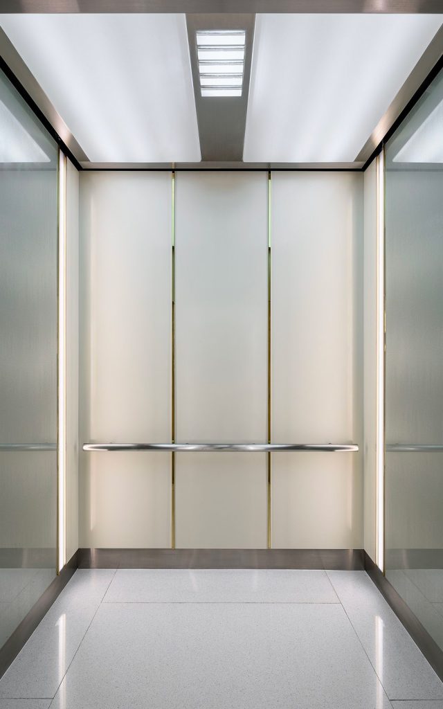 PVD coloured stainless steel in Nickel Hairline and Chrome Vibration for elevator cab interior with Brass Mirror detailing and Chocolate Vibration frieze and kickplate. - Krungsri Ploenchit Tower, Thailand. - Elevator: A global elevator brand - Architecture and design: Palmer & Turner, Hong Kong - PVD coloured stainless steel by Double Stone Steel in partnership with John Desmond Ltd.