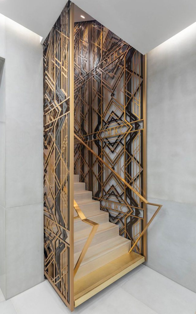 Custom three-layer screen, as stair balustrading, in PVD coloured stainless steel Brass, Gunmetal and Bronze Vibration. - Renovated office building, Axtell House, 23-24 Warwick St, Soho, London W1B 5NQ - Architects: Darling Associates - Client: E&A Property Investment Company - Laser-cutting, fabrication and PVD coloured stainless steel: John Desmond Ltd