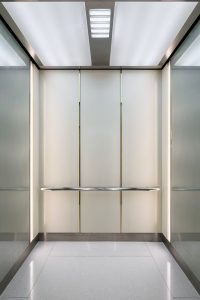 V-Grooved and folded elevator cab interior in PVD coloured stainless steel. - Krungsri Ploenchit Tower, Thailand. - Elevator: A global elevator brand - Architecture and design: Palmer & Turner, Hong Kong - PVD coloured stainless steel by Double Stone Steel in partnership with John Desmond Ltd.
