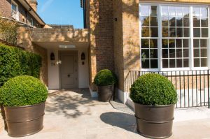 Exterior planters for 54 Bedford Gardens, Notting Hill, London. - Bedford Gardens, London. - Architects: Nash Baker - Interior Designers: DeSalles Flint - Architectural metalwork & PVD stainless steel: John Desmond Ltd. - Planters: 800 mm diameter x 600 mm high
