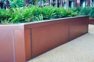 Planters in Bronze sandblasted PVD stainless steel in Embassy Gardens, Nine Elms, Wandsworth, London, UK - Bespoke design and fabrication by John Desmond Ltd working with In-Ex Landscapes as part of the Embassy Quarter centred on the US Embassy.