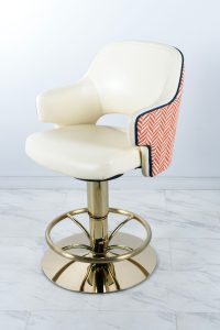 Casino chair by Gary Platt with base in PVD coloured stainless steel in Almond Gold which gives the look of a creamy brass colour. Chair base fabricated and coloured by Double Stone Steel Ltd.
