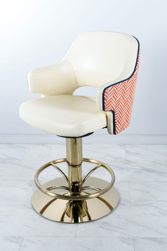 Casino chair by Gary Platt with base in PVD coloured stainless steel in Almond Gold which gives the look of a creamy brass colour. Chair base fabricated and coloured by Double Stone Steel Ltd.