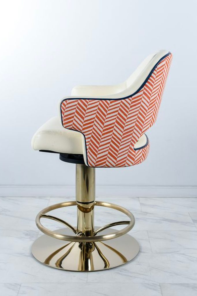 Casino chair by Gary Platt with base in PVD coloured stainless steel in Almond Gold which gives the look of a creamy brass colour. Chair base fabricated and coloured by Double Stone Steel Ltd.